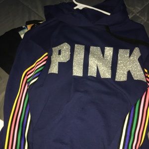 Dark blue hoodie with rainbow lines on sleeve